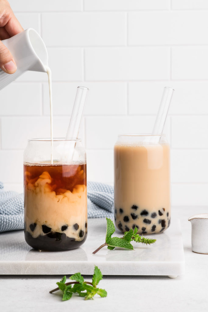 milk boba tea in glass with glass straws