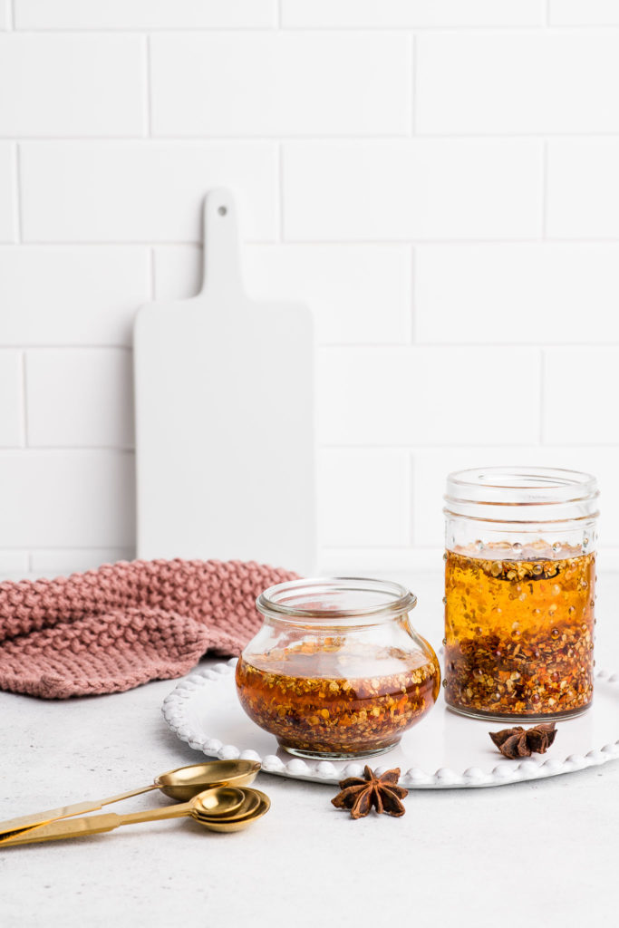 homemade chilli oil in glass jars with star anise