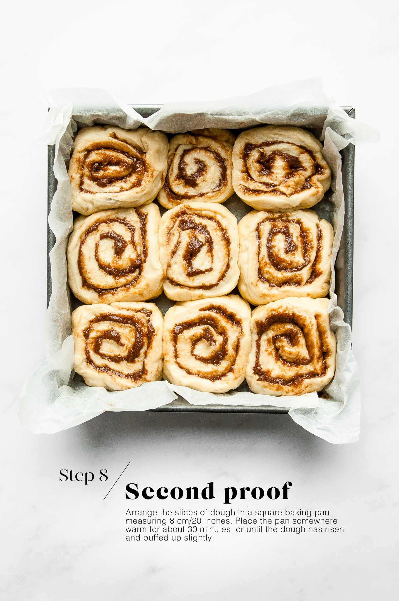 cinnamon rolls in baking pan before going into the oven