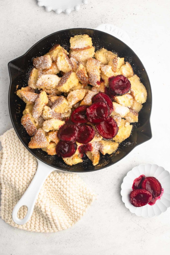 kaiserschmarrn with plum compote in cast iron pan