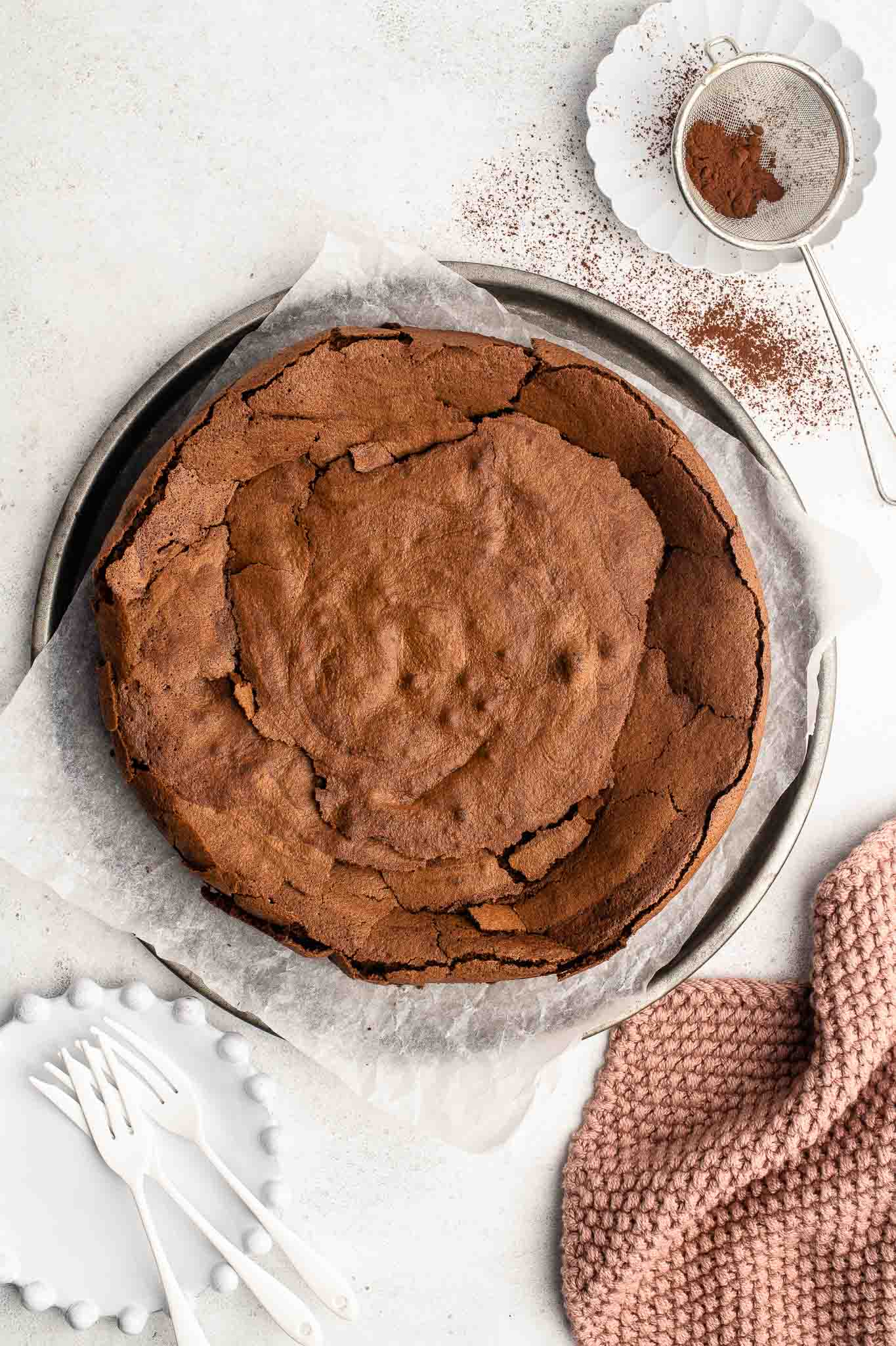 flourless chocolate cake on metal tray