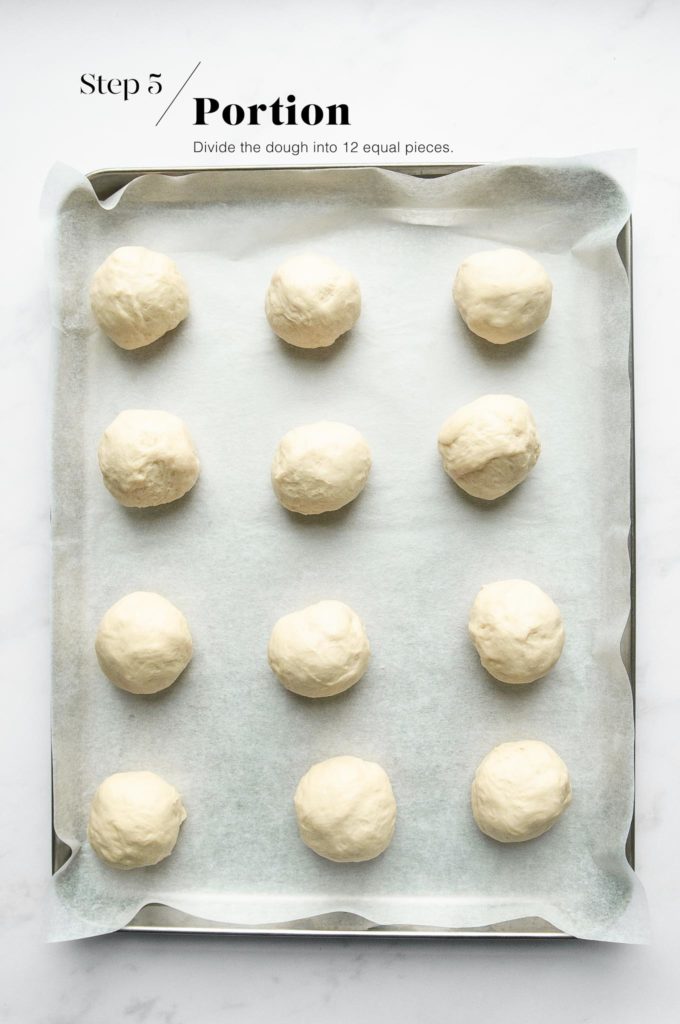 dough rolled into 12 portions on baking tray