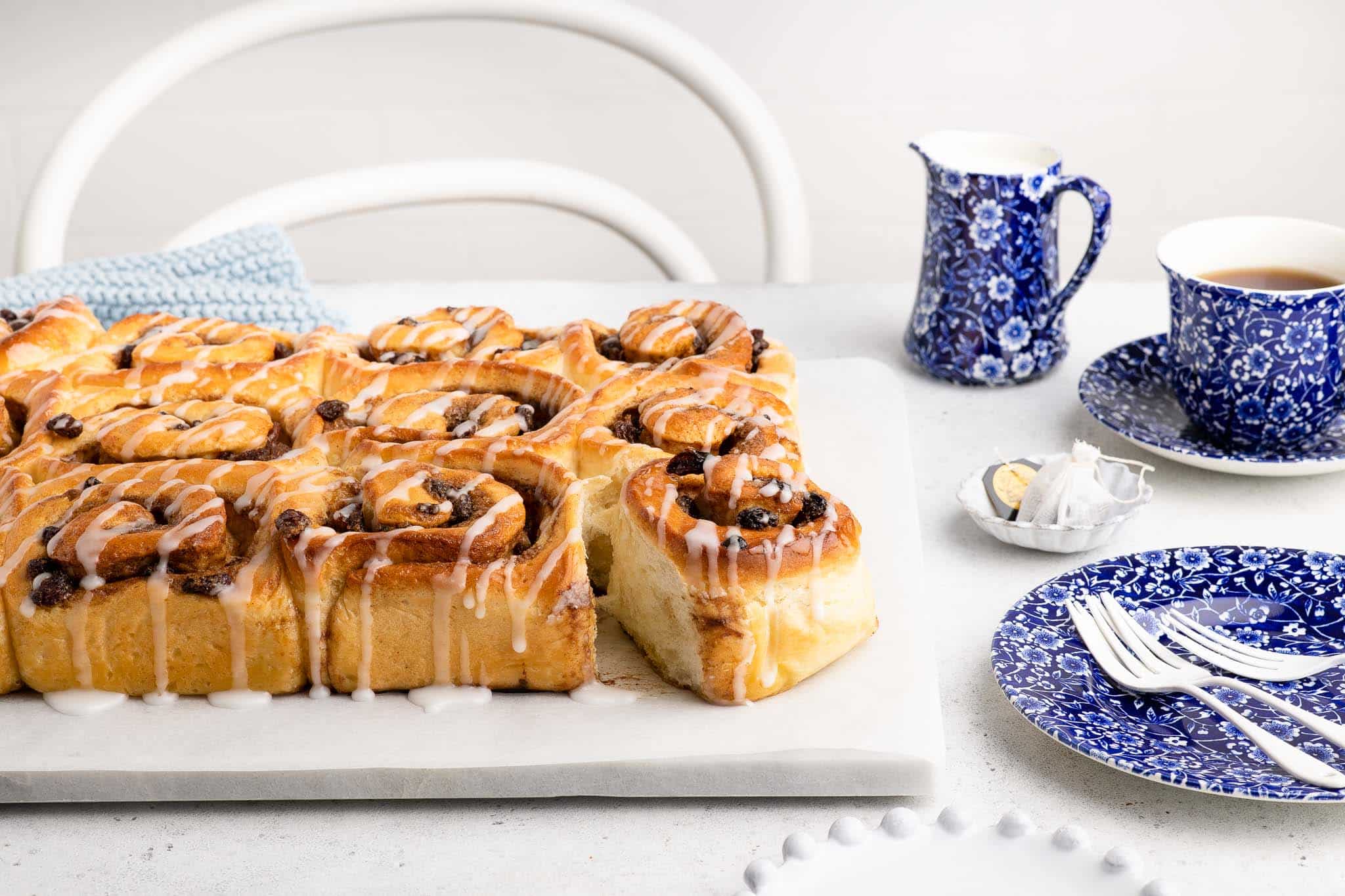 chelsea buns with cup of tea