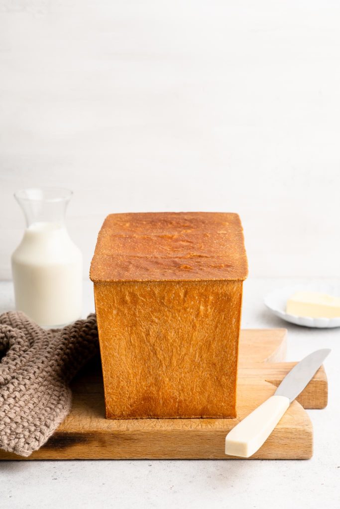japanese milk bread loaf with white knife