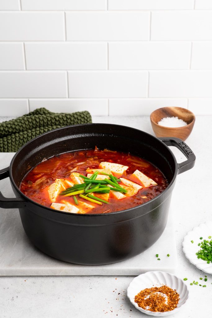 kimchi stew with tofu in black cast iron pot