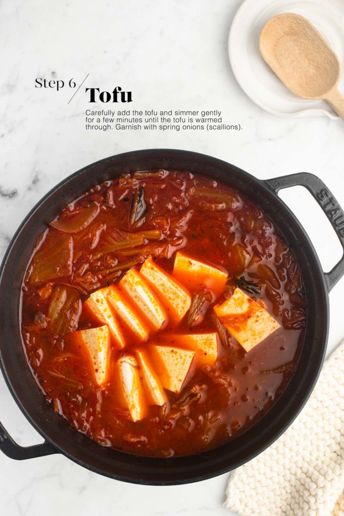 kimchi jjigae with silken tofu in cast iron pan