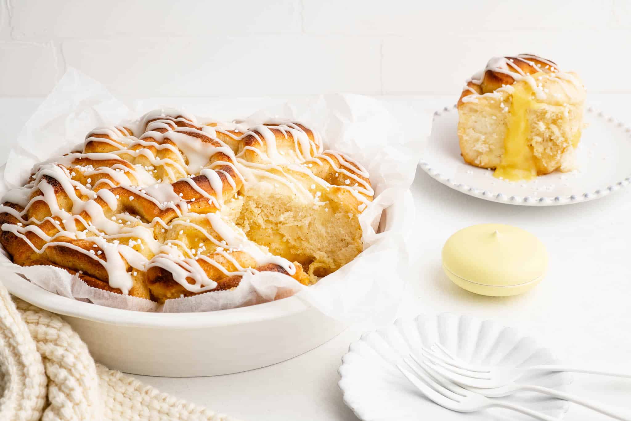 lemon curd rolls in round white baking dish