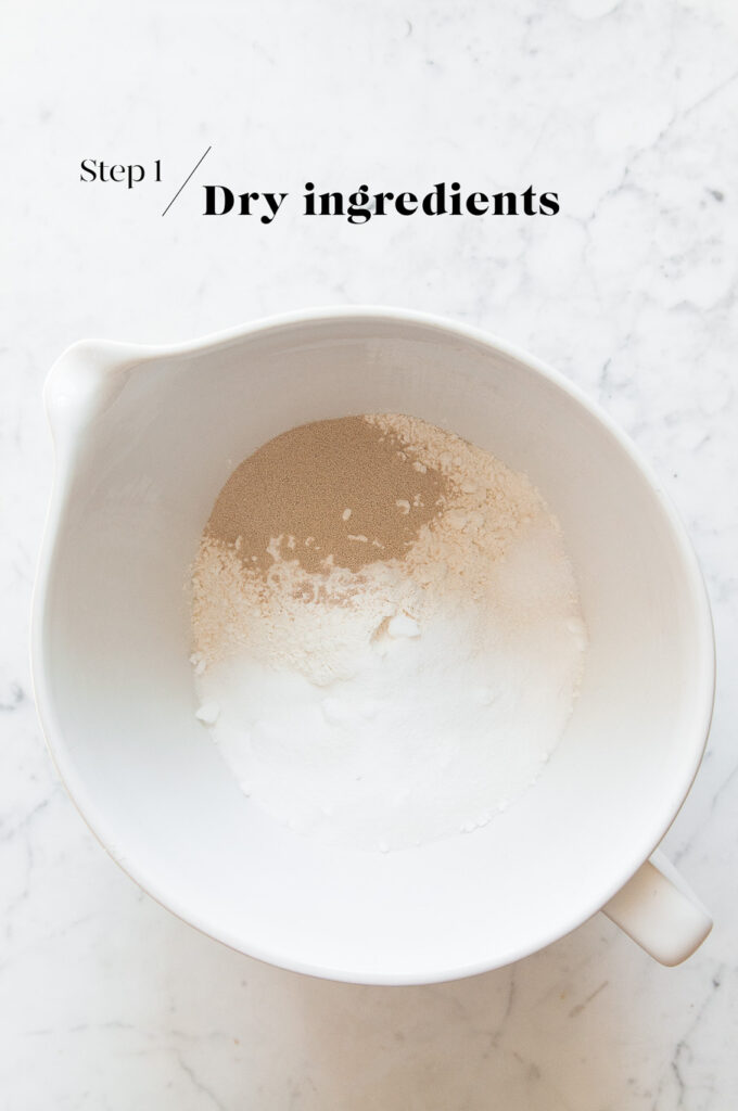dry ingredients for dough in white mixing bowl