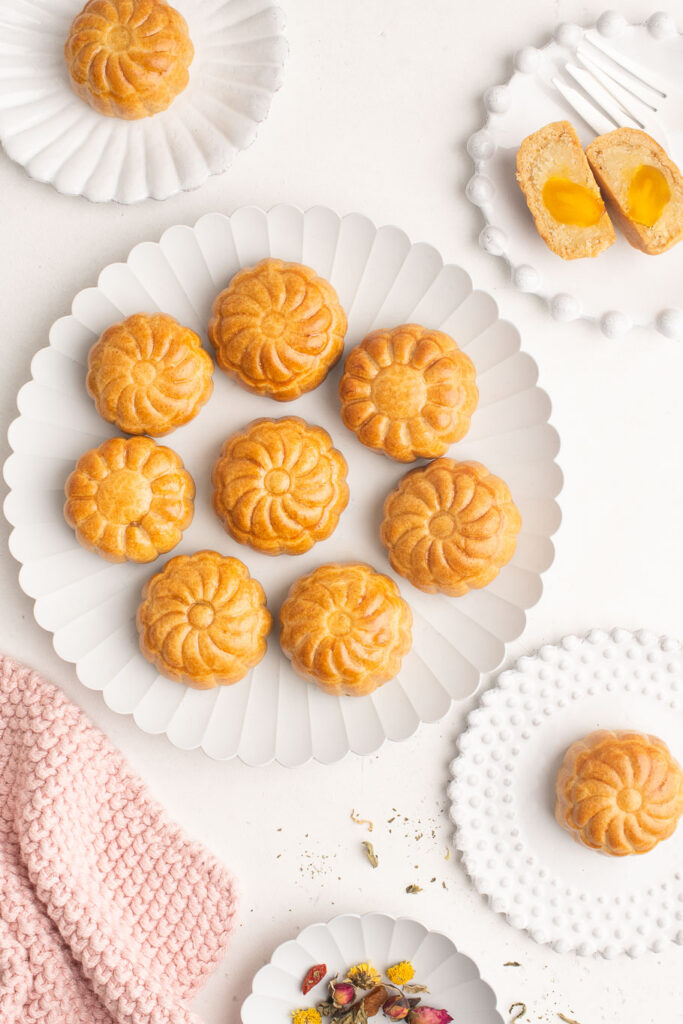 mooncakes with lotus seed paste and salted egg yolks on large plate
