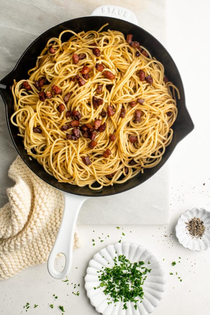 pasta with pancetta in white skillet