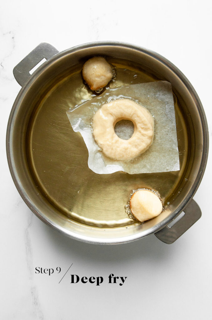 frying donuts in oil in saucepan