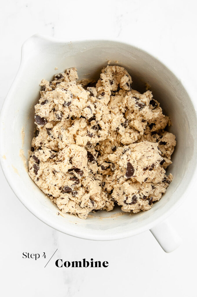 chocolate chip cookie dough in white mixing bowl
