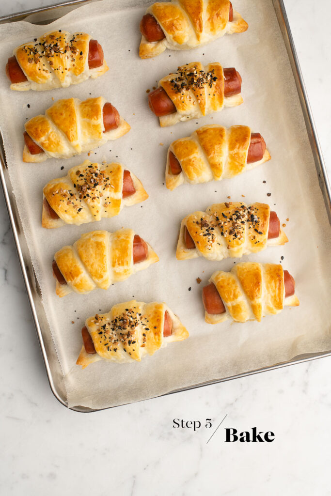 baked pigs in blankets on baking tray