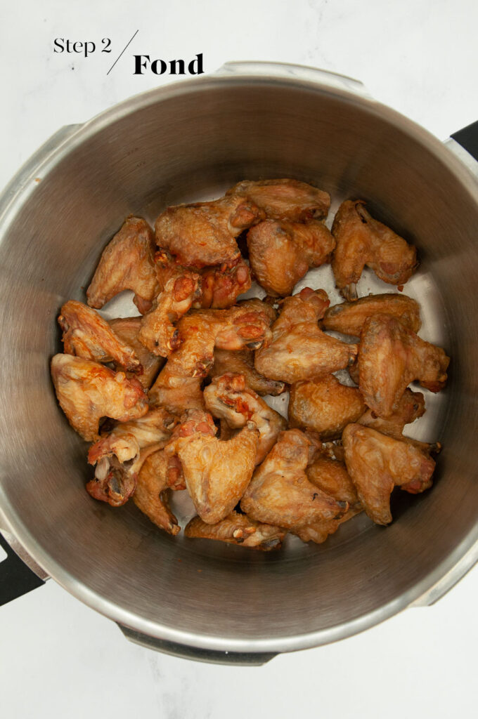 roasted chicken wings in stock pot