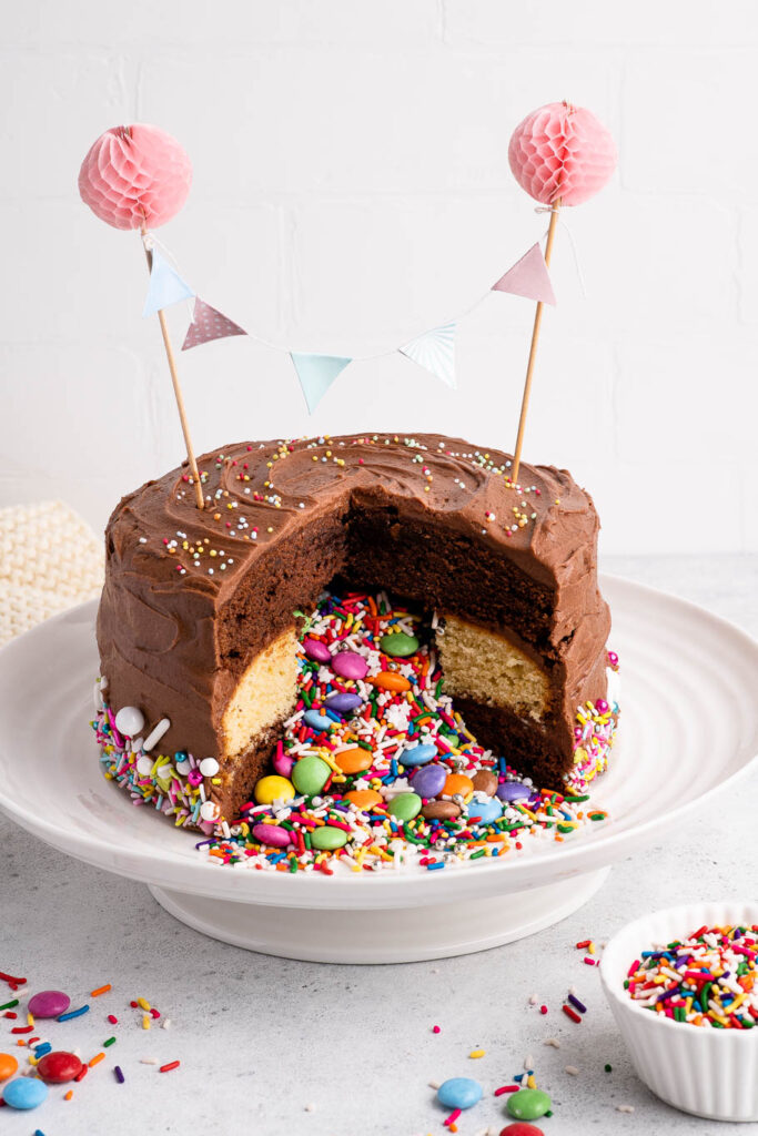 chocolate piñata cake filled with sprinkles and candies