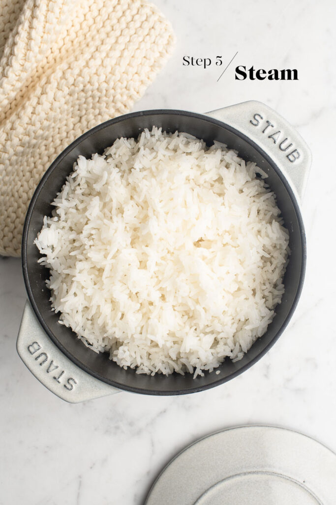 fluffed and steamed rice in cast iron pot