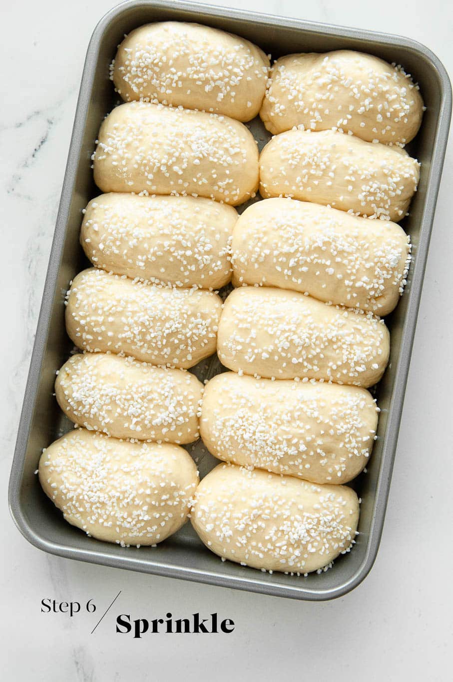 pains au lait in baking pan before going into oven