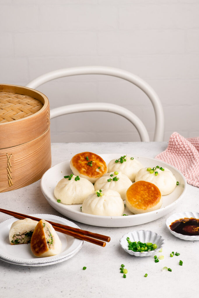 pan-fried pork buns with bamboo steamer baskets