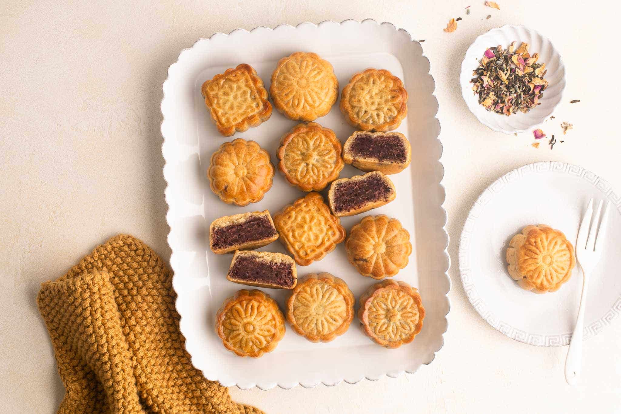 mooncakes with red bean paste on white platter