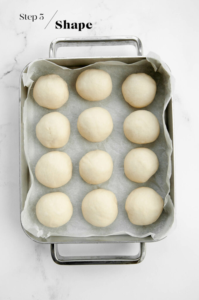 bread rolls on baking tray before proofing