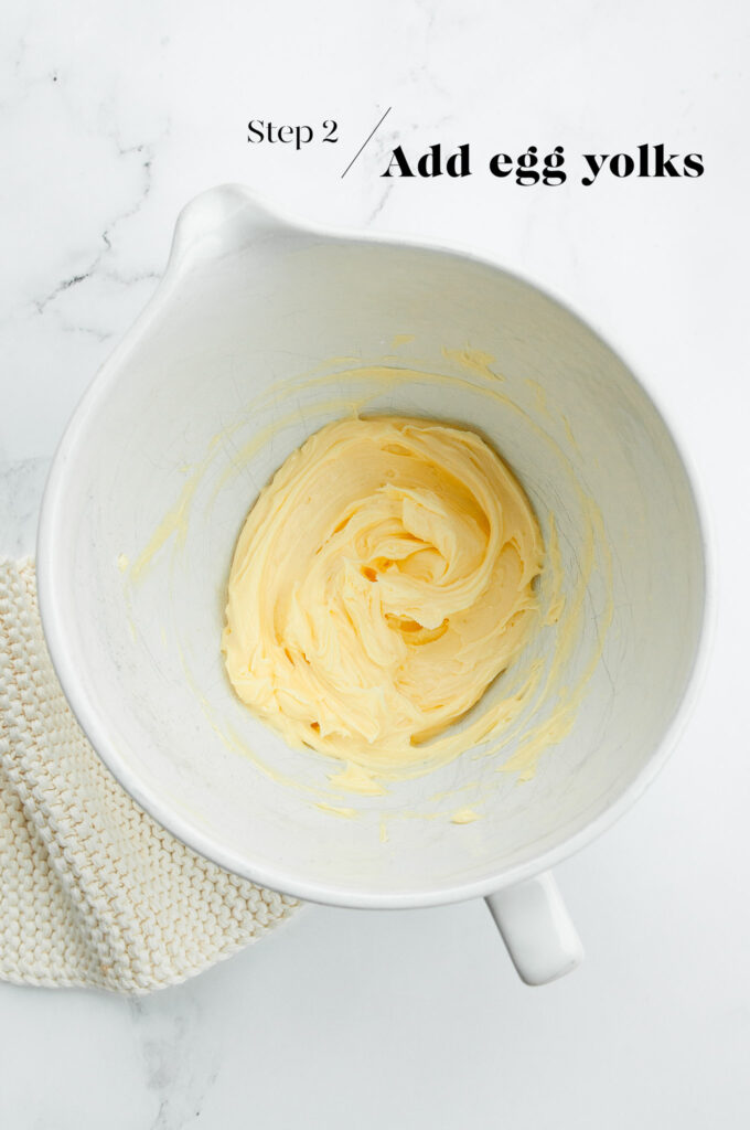 creamed butter and sugar in white mixing bowl