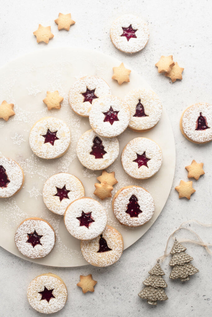 christmas linzer cookies dusted with icing sugar