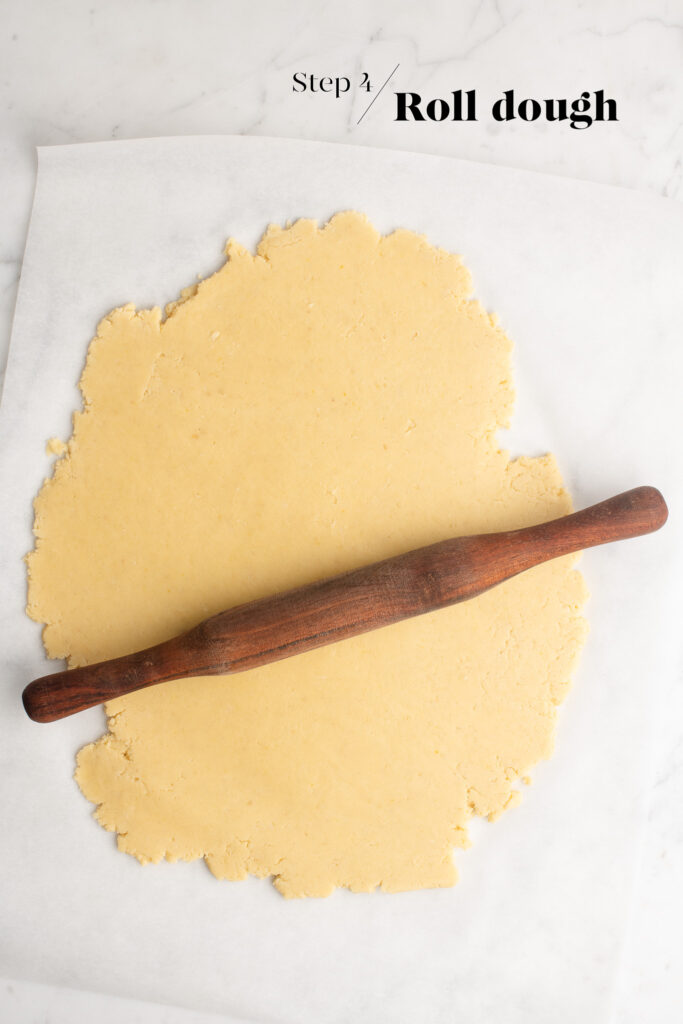 rolling out dough on baking paper