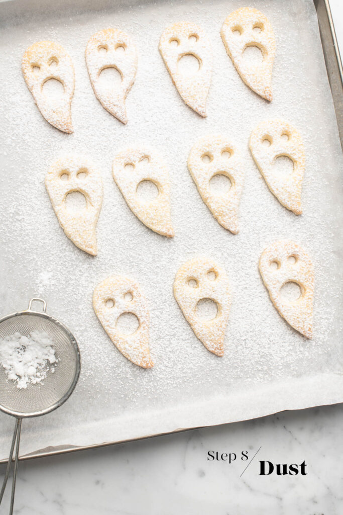 ghost linzer cookies dusting with icing sugar