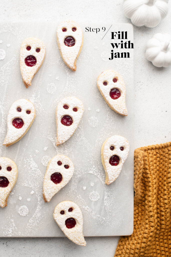 halloween ghost linzer cookies on marble tray