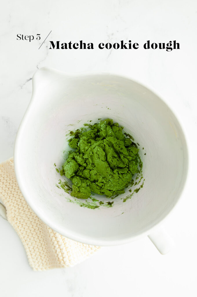 matcha cookie dough in white mixing bowl