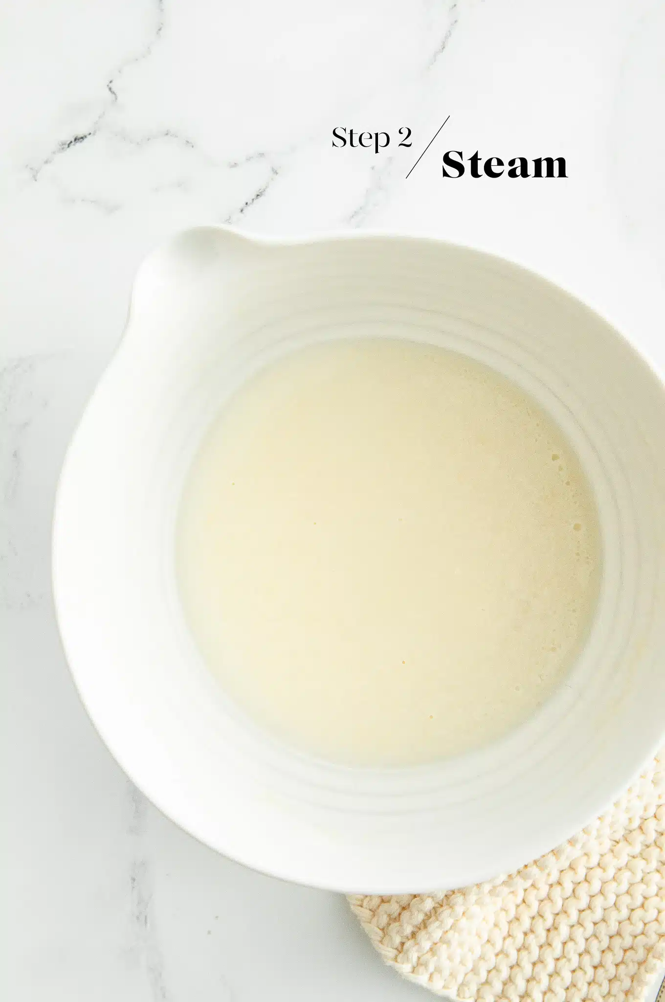 steaming mochi dough in white bowl
