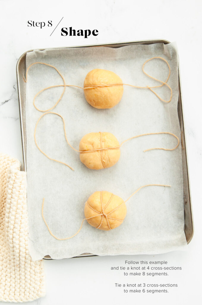 shaping pumpkin bread rolls with kitchen string