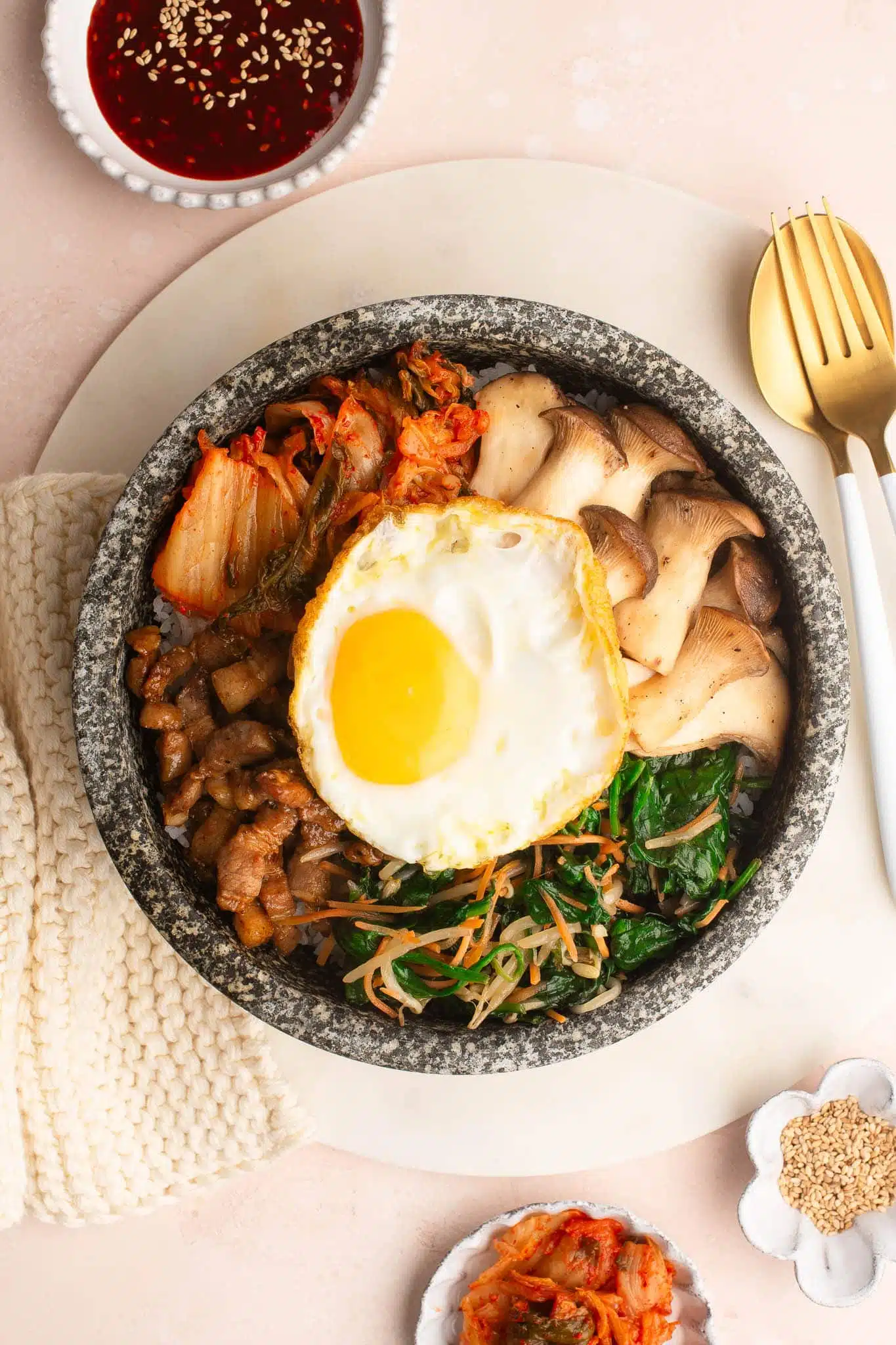 bibimbap with fried egg in dolsot stone bowl