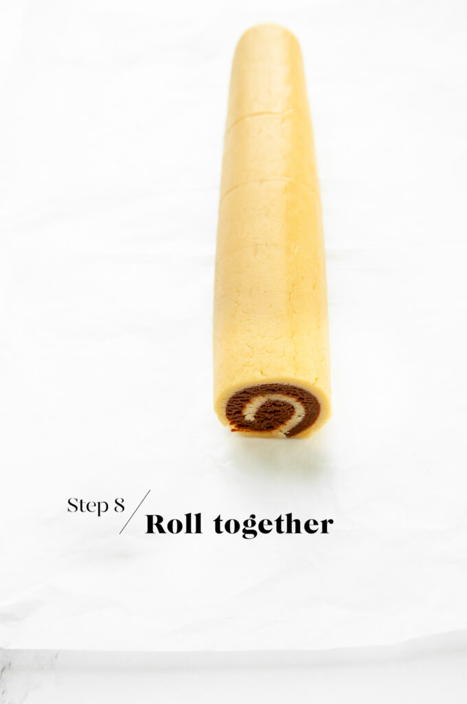 rolling together dough to make pinwheel cookies