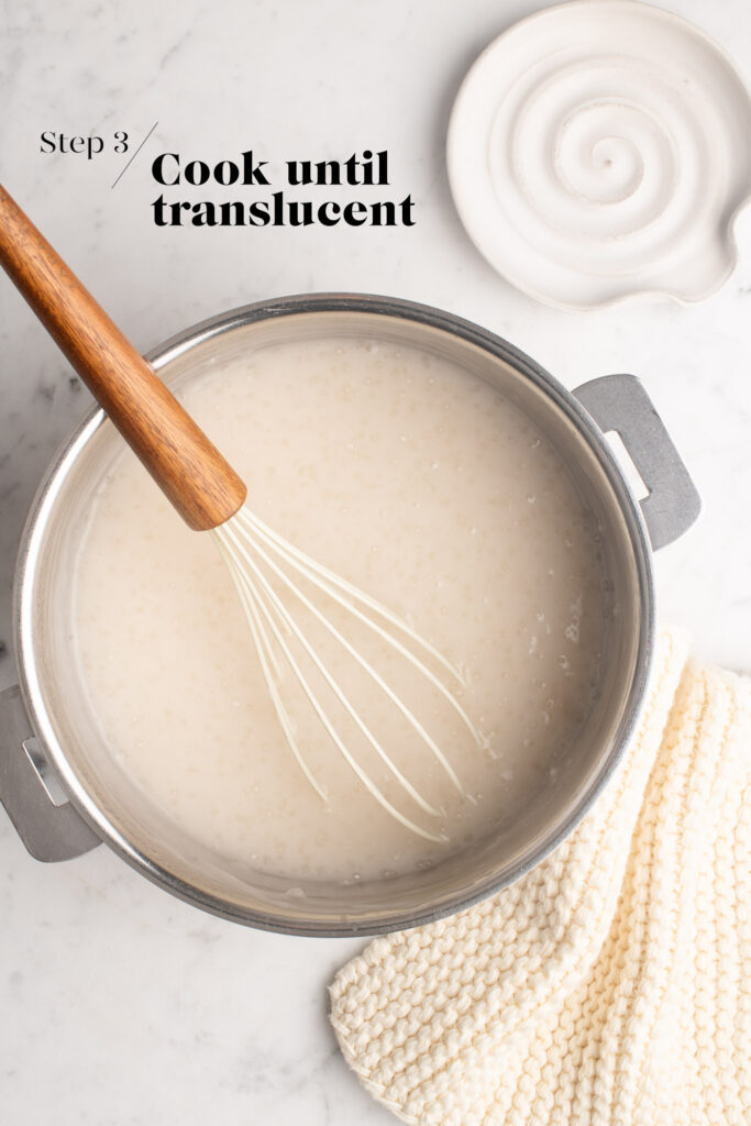 coconut tapioca pudding with whisk in saucepan