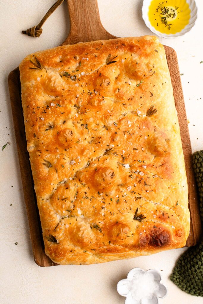 focaccia loaf on wooden board