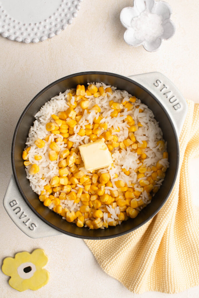 corn rice with butter in cast iron pot