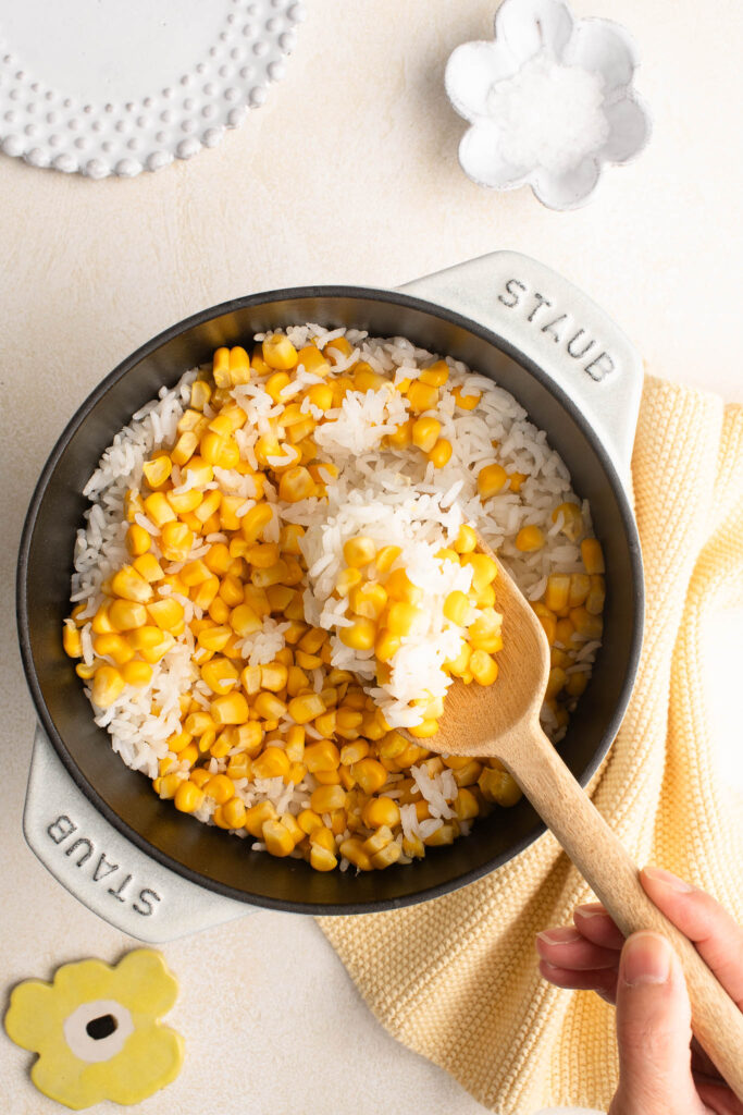 corn rice with wooden spoon