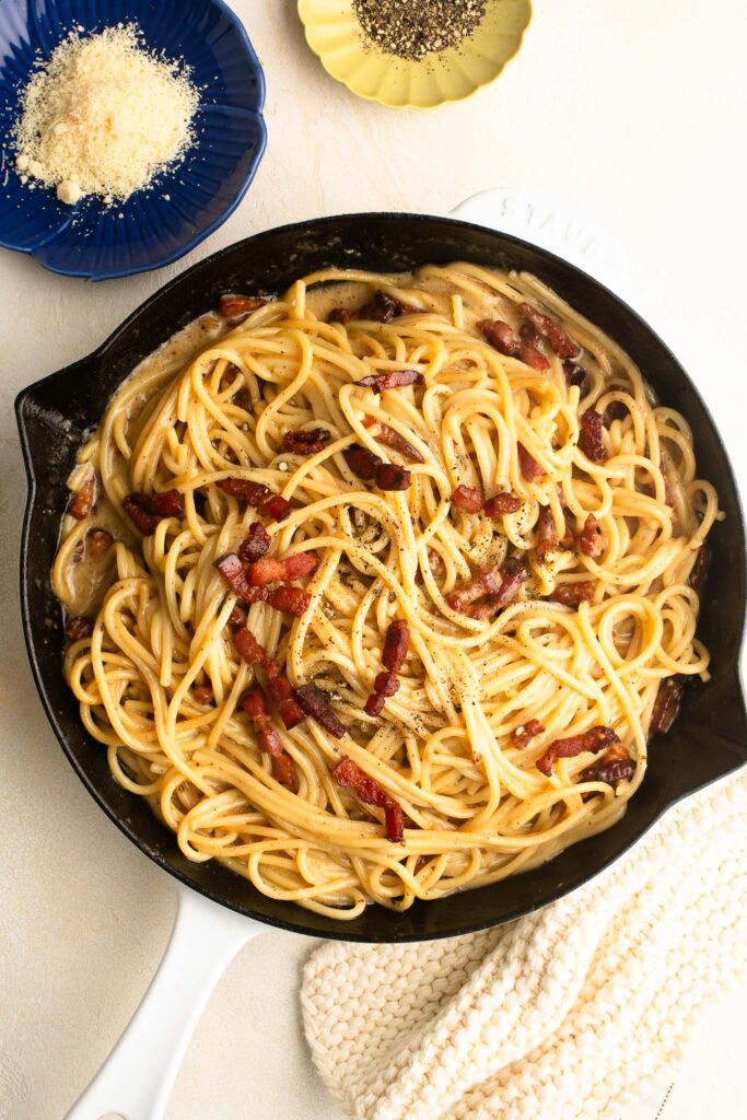 spaghetti carbonara in white skillet