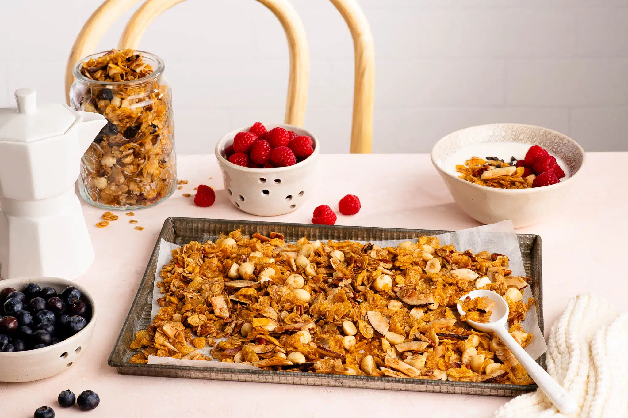 homemade granola on baking tray on breakfast table