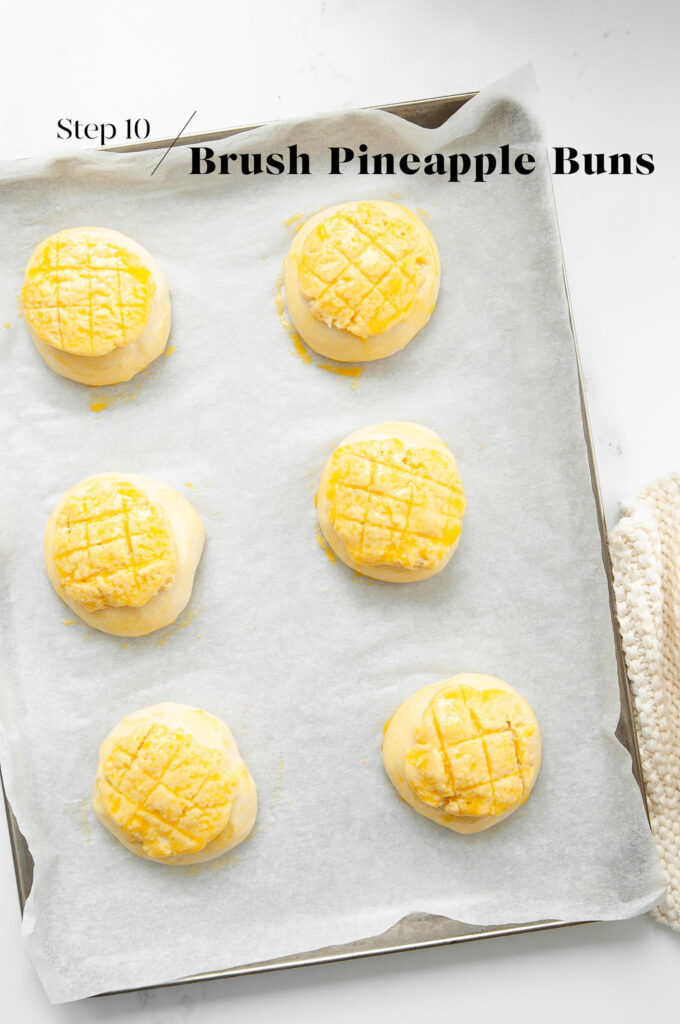 pineapple buns brushed with egg wash before baking