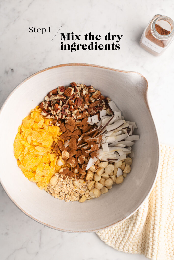 dry ingredients for granola in white mixing bowl