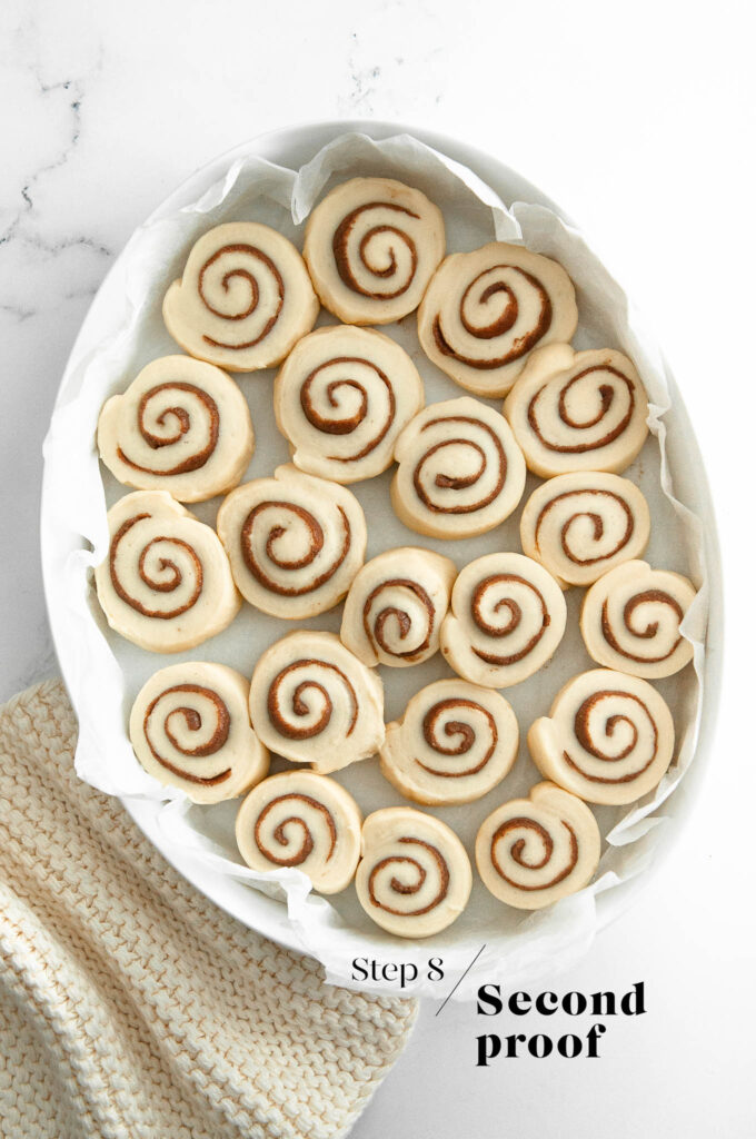 mini cinnamon rolls before baking in white dish