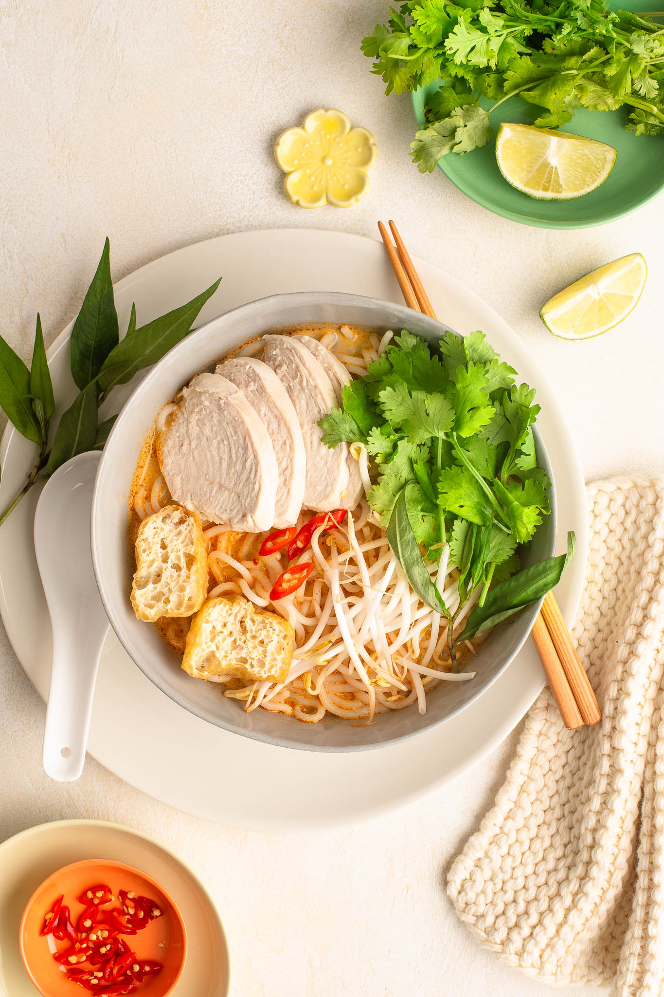 chicken laksa in noodle bowl with chopsticks