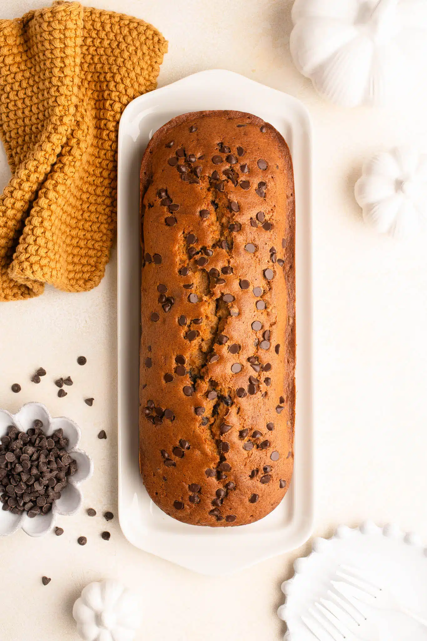 chocolate chip pumpkin bread on white platter