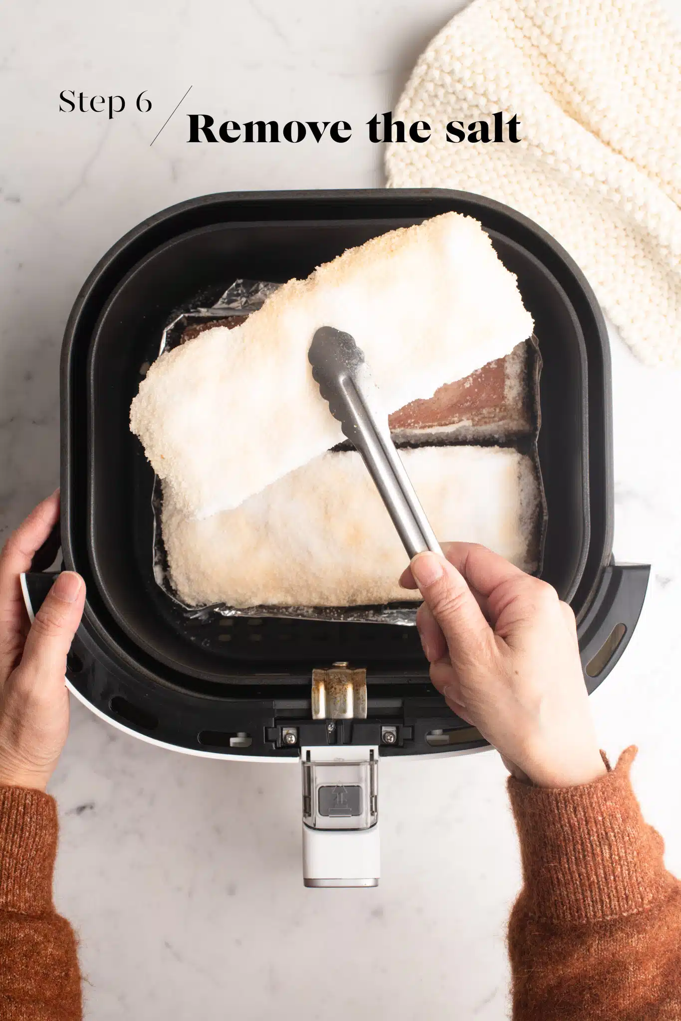 removing the salt crust from pork belly cooked in the air fryer