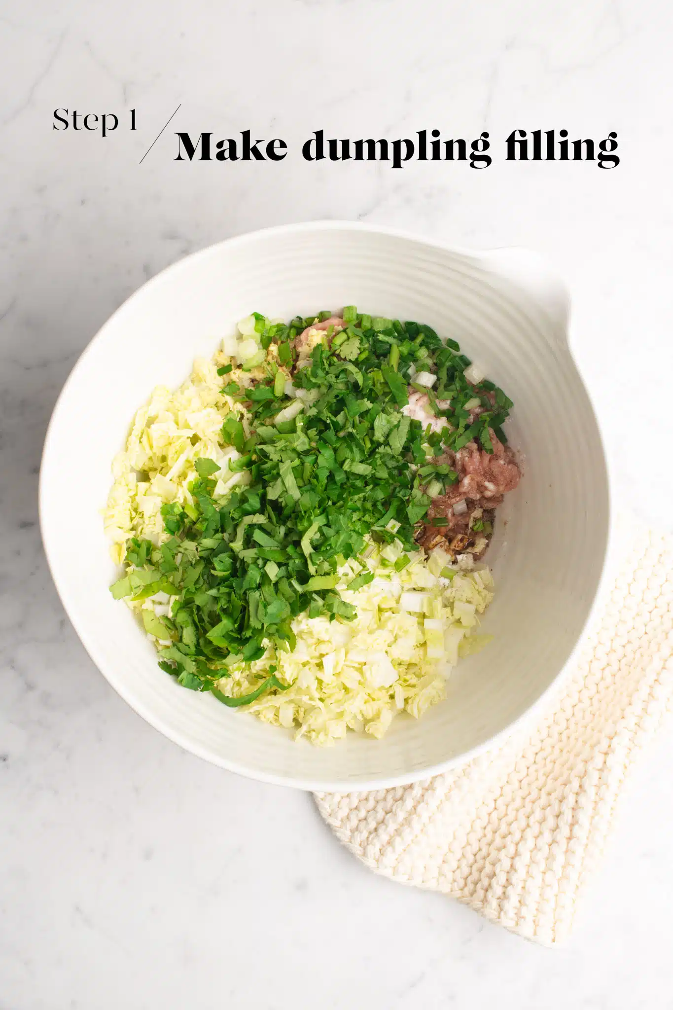 ingredients for dumpling filling in white mixing bowl