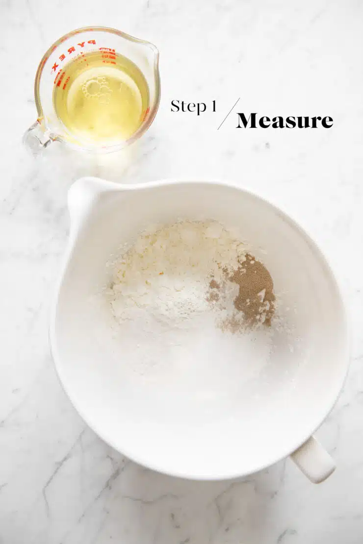 dry ingredients for bao buns in white mixing bowl