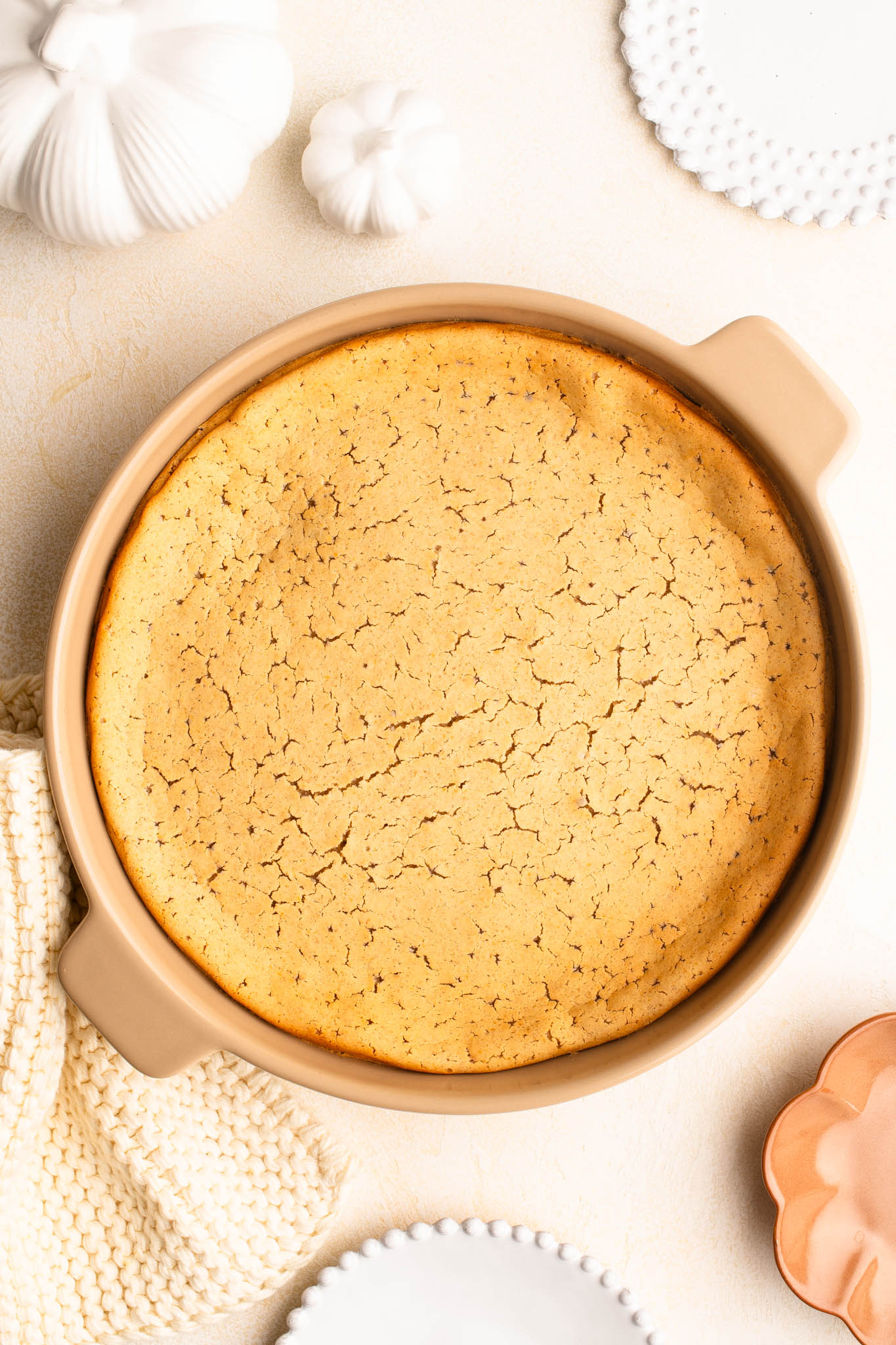 pumpkin mochi cake in round serving dish