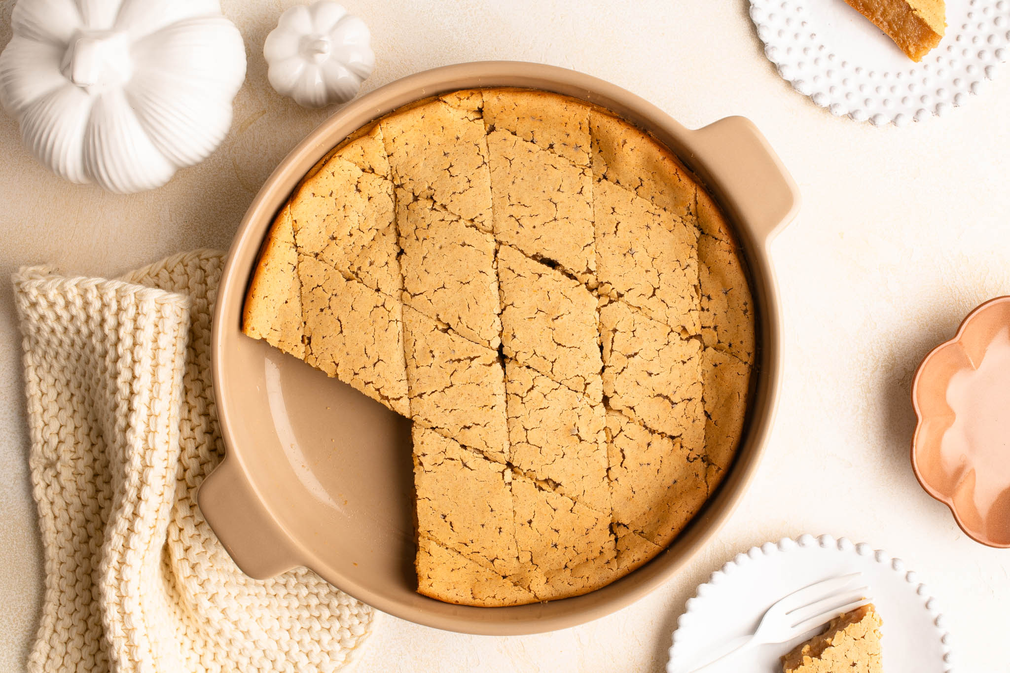 sliced pumpkin mochi cake in ceramic dish